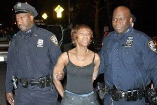 Yvonne Hines being taken into custody by the police